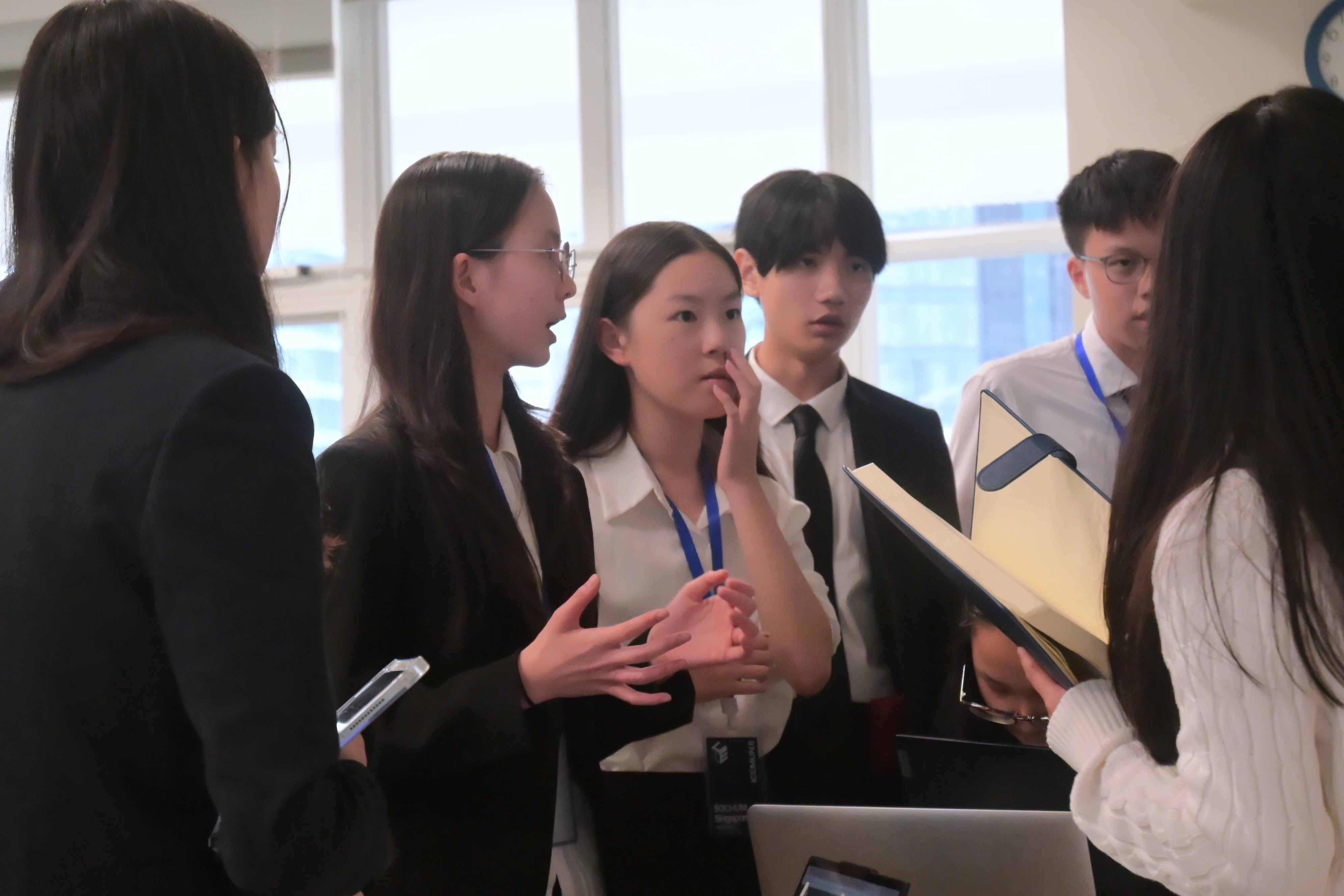ICEMUN II delegates collaborating on resolution draft